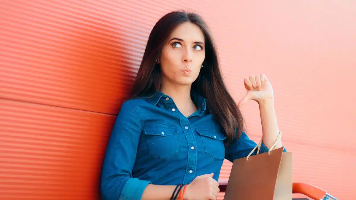 woman embarassed by her purchases