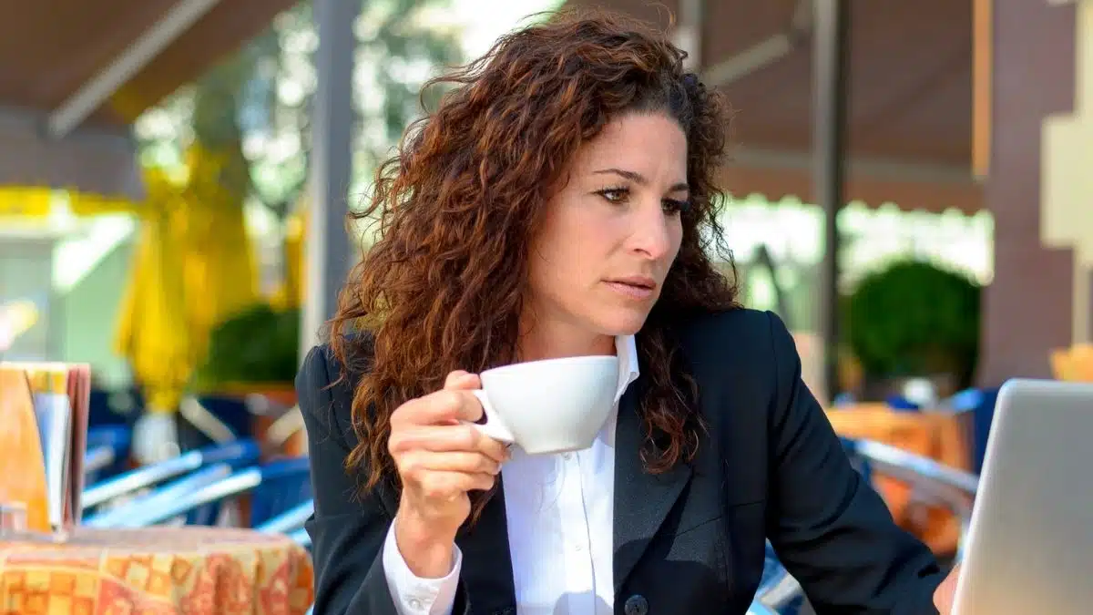 woman glasses coffee thinking outside