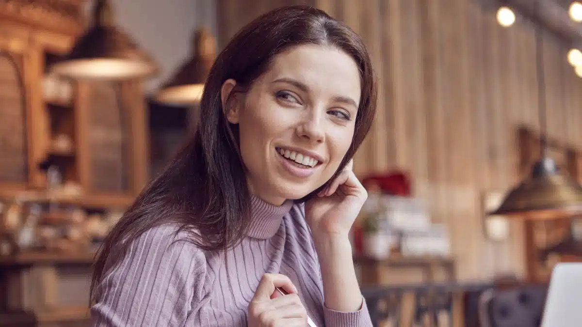 woman happy at a coffee shop