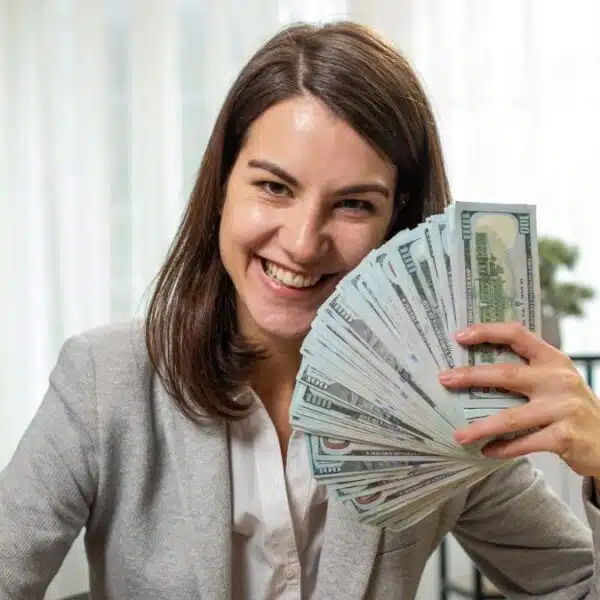 woman holding cash in the office
