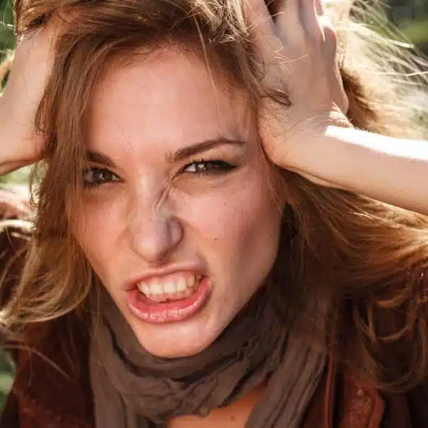 woman holding up her hair