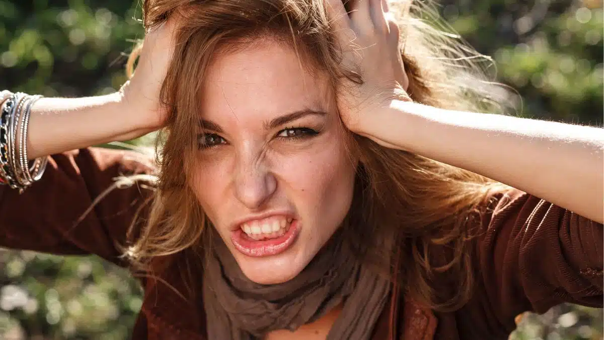 woman holding up her hair