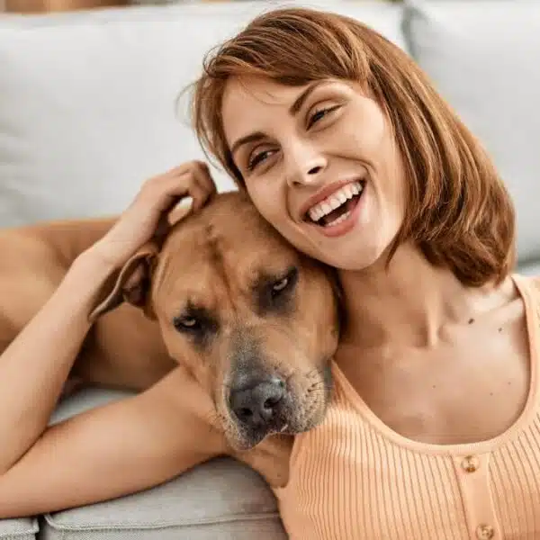 woman hugging her dog