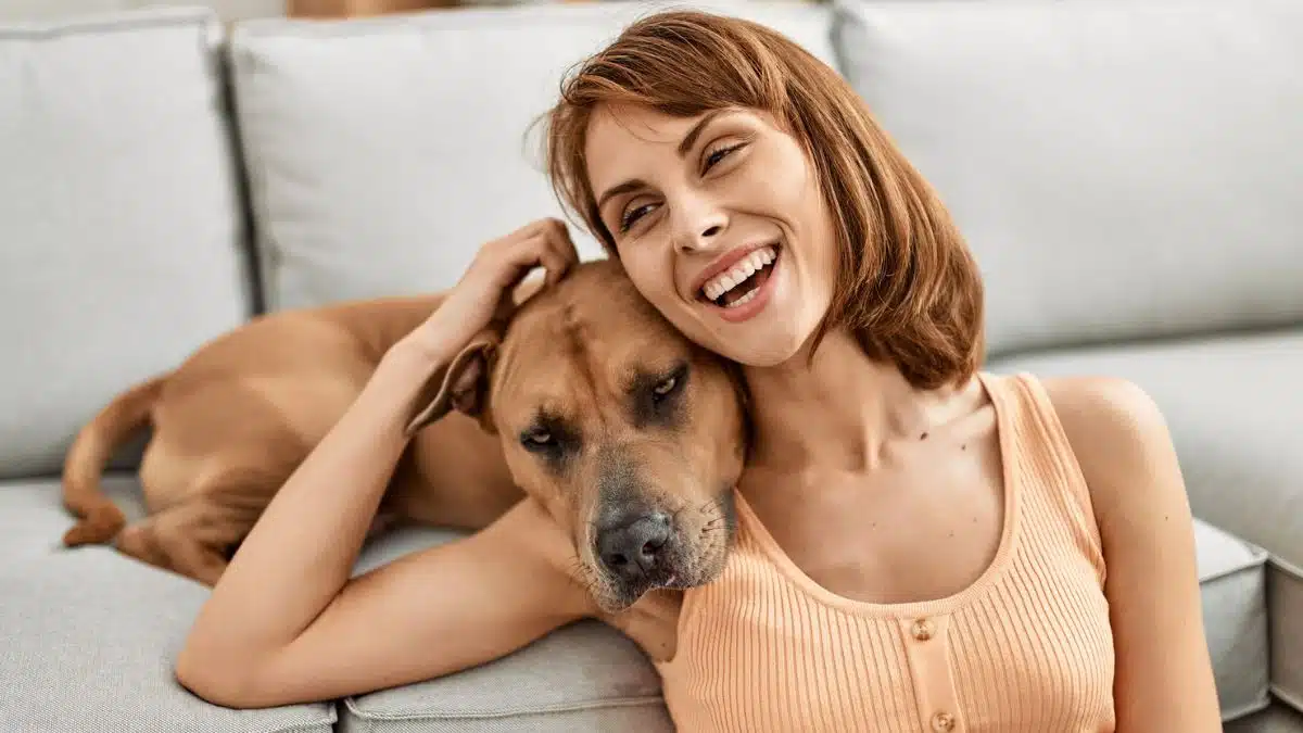 woman hugging her dog