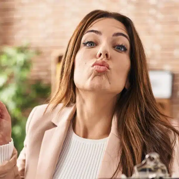 woman in suit making a funny face