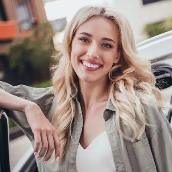woman leaning on car door
