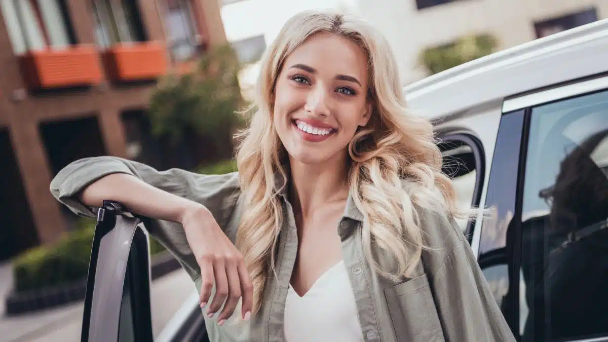 woman leaning on car door