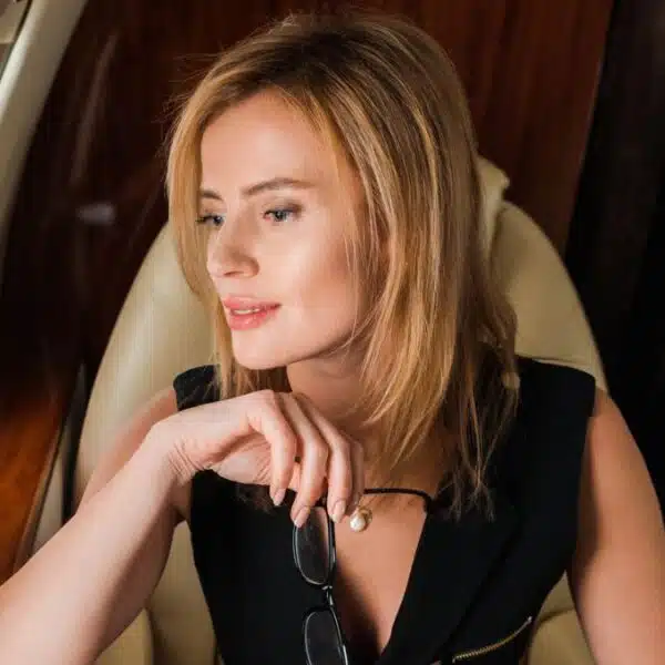 woman looking out the window in a plane