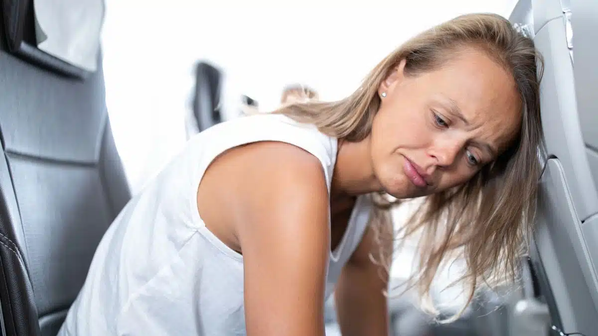 woman miserable in an airplane