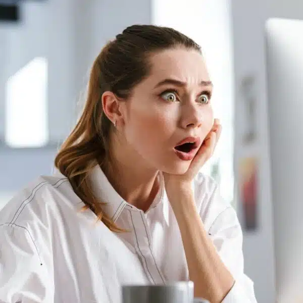 woman reading on monitor laptop