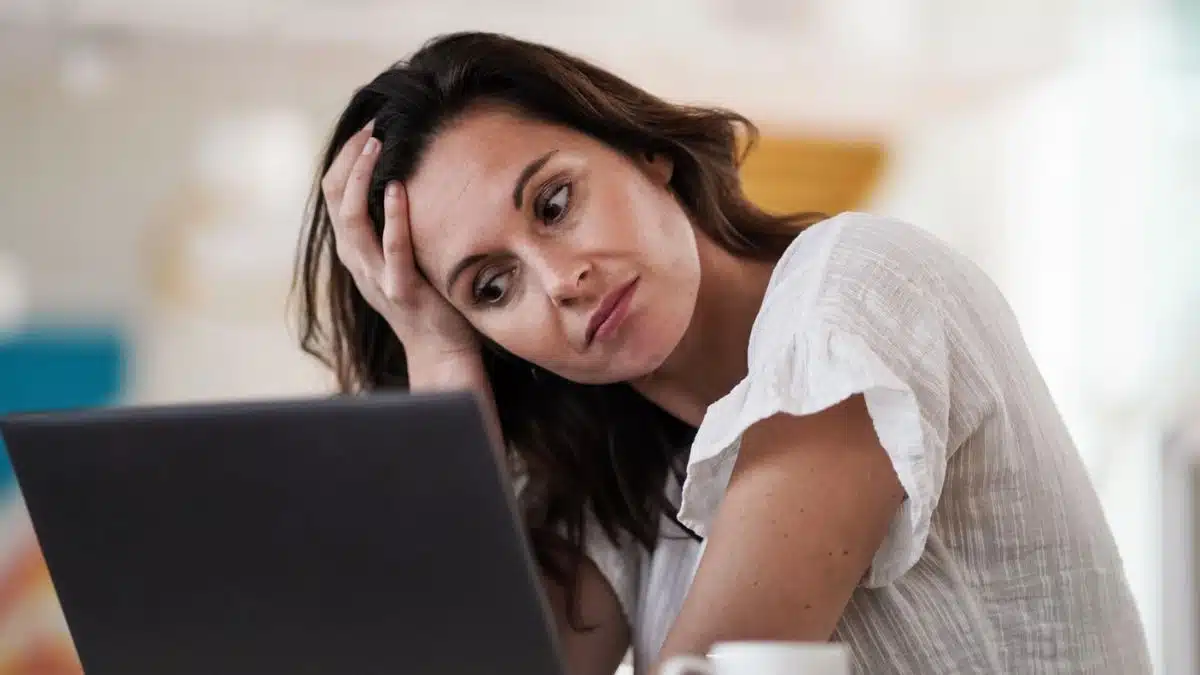 woman sad at her bank account