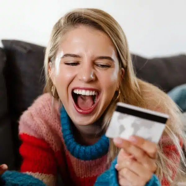 woman screaming at a credit card