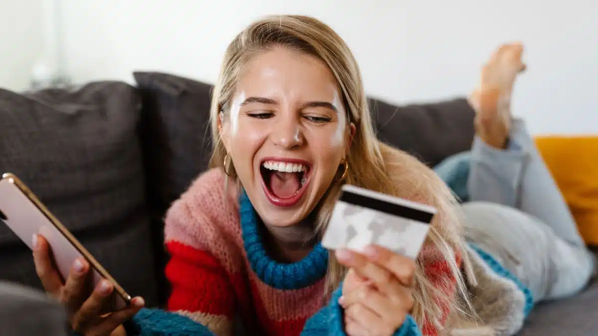 woman screaming at a credit card
