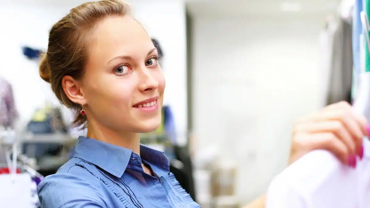 woman shopping holding clothes