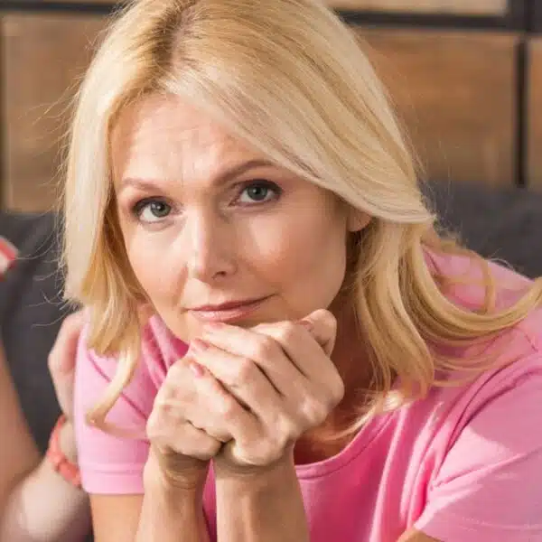 woman sitting disappointed at home