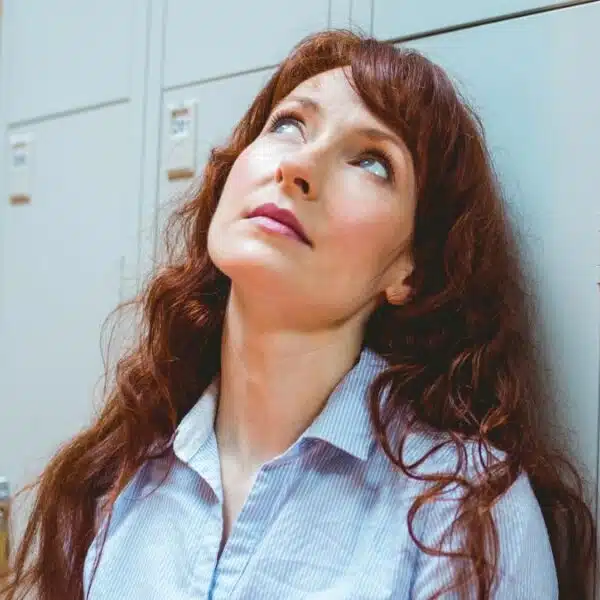woman standing at a locker