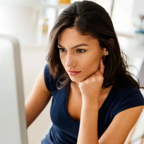 woman staring at her computer