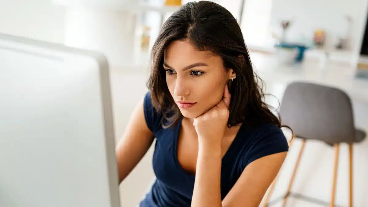 woman staring at her computer