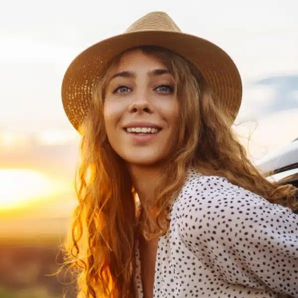 woman sticking her head out of car