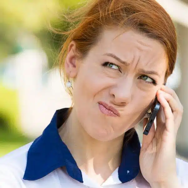 woman stressed on the phone in the parking
