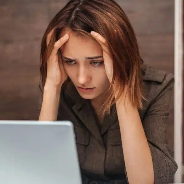 woman stressed sitting at her desk