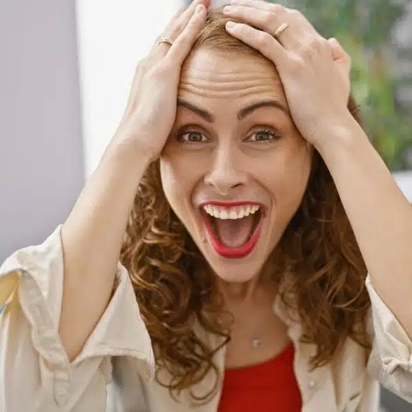 woman stunned sitting at home