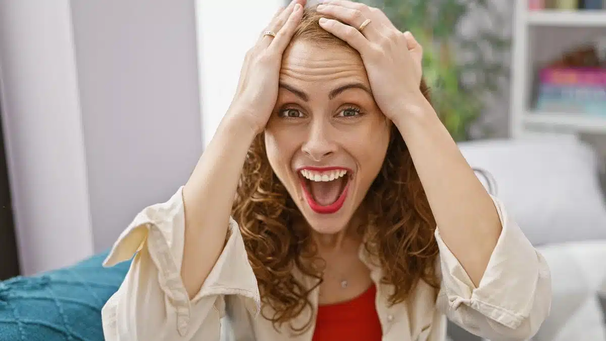 woman stunned sitting at home