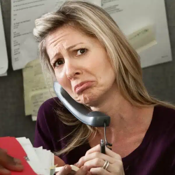 woman taking phone calls in the cubicle