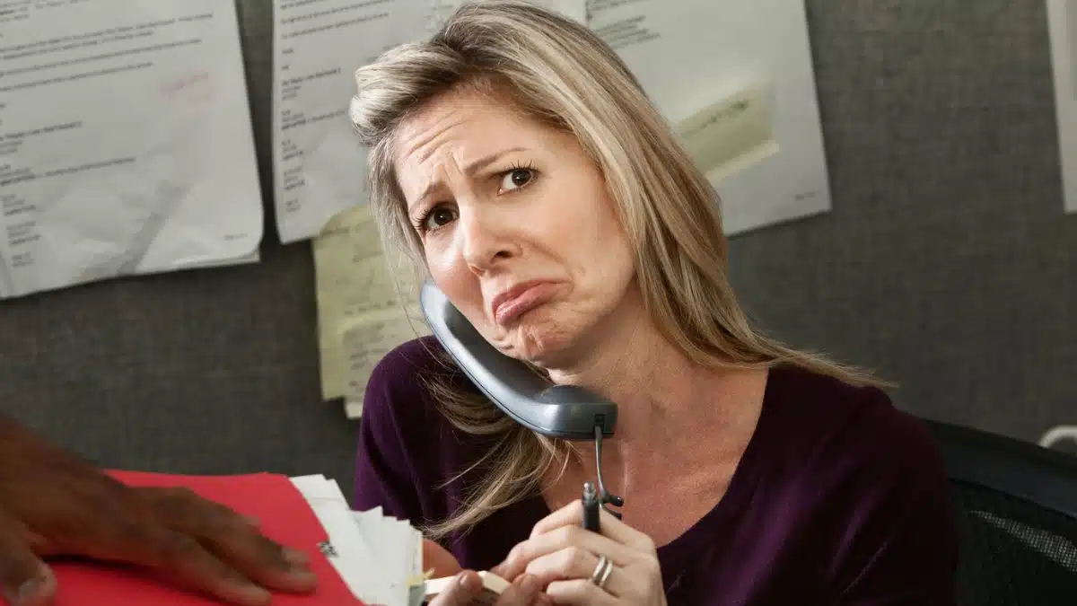 woman taking phone calls in the cubicle