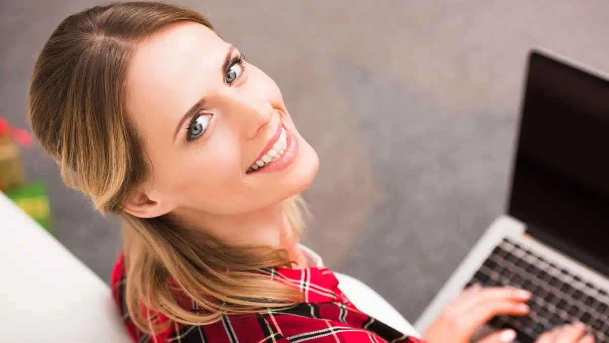 woman typing on laptop