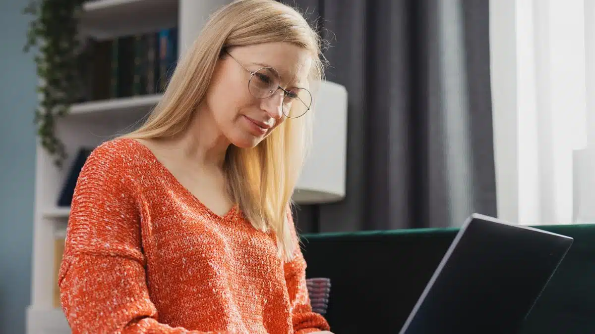 woman working on her laptop with her glasses