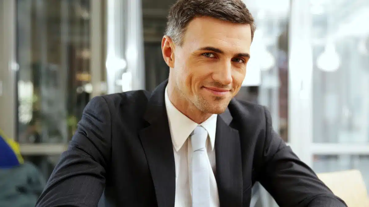 business man smiling at an office