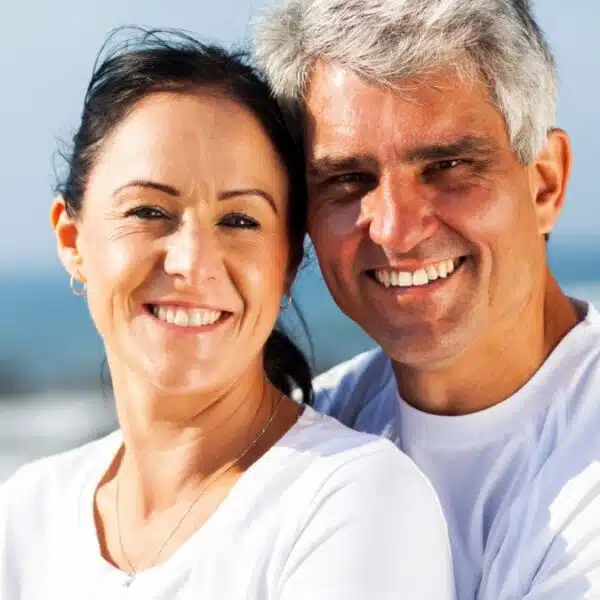 couple hugging on the beach