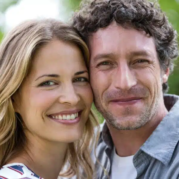 couple smiling outside park