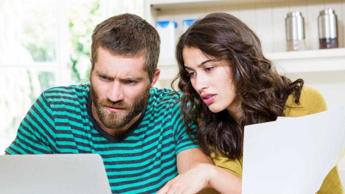 couple staring at bills