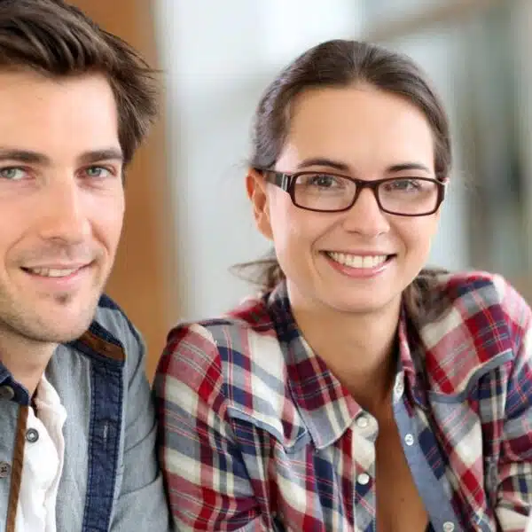 coworkers working on the laptop together