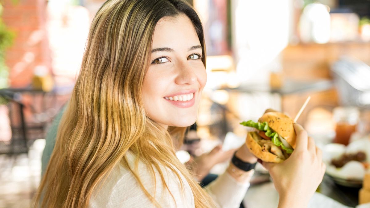 eating a burger at a restaurant
