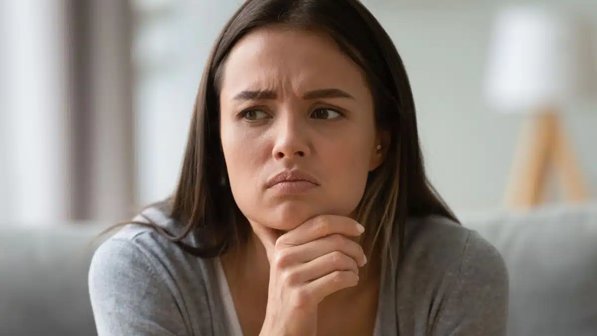 girl stressed in the living room thinking