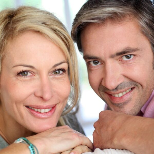 happy couple sitting outside alone