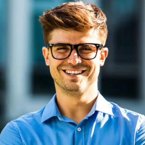 man glasses standing outside