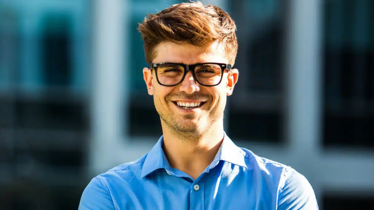 man glasses standing outside