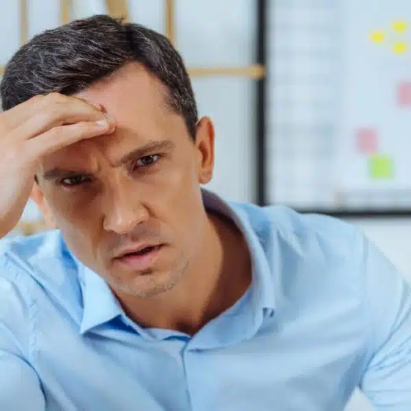 man overworked doing his job