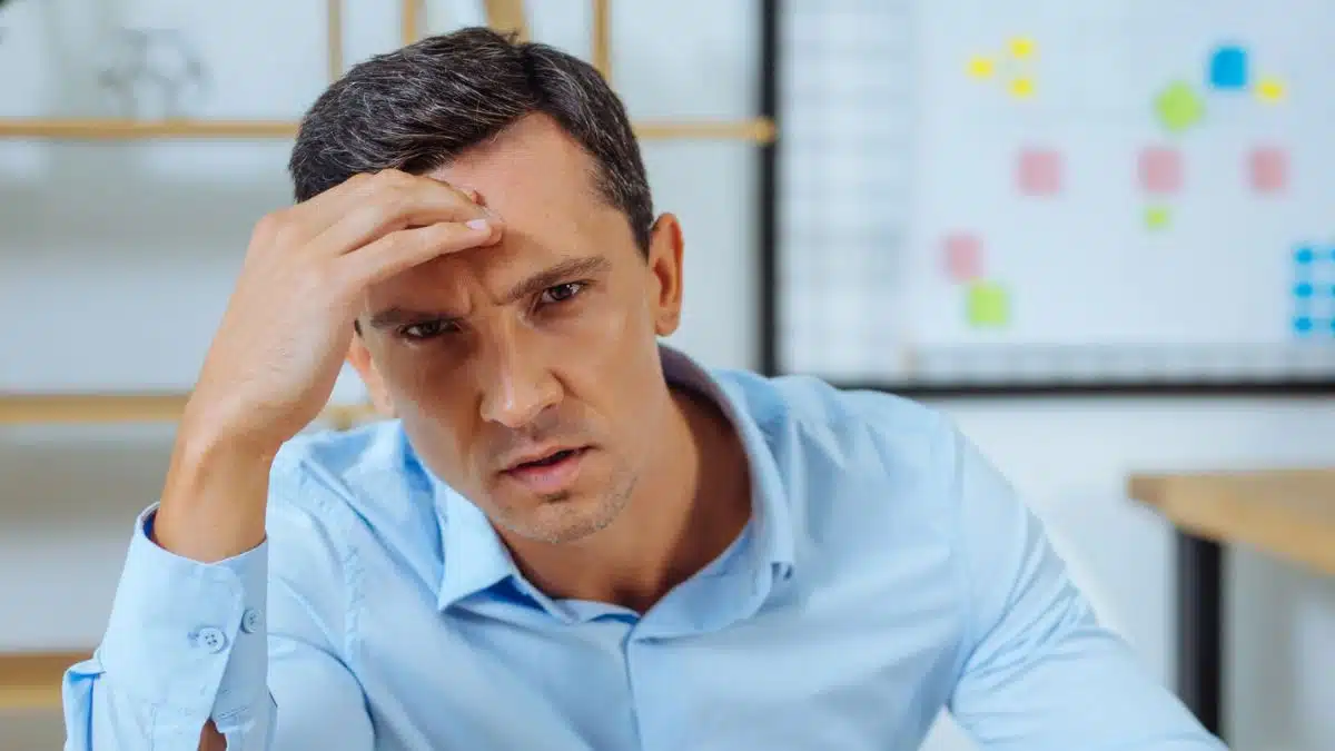 man overworked doing his job