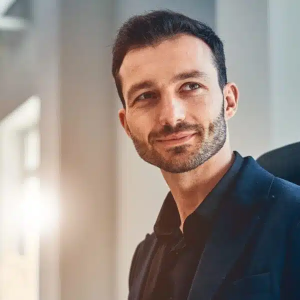 man sitting in an office desk chair