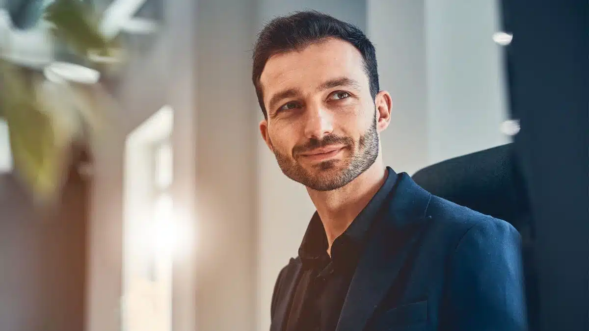 man sitting in an office desk chair