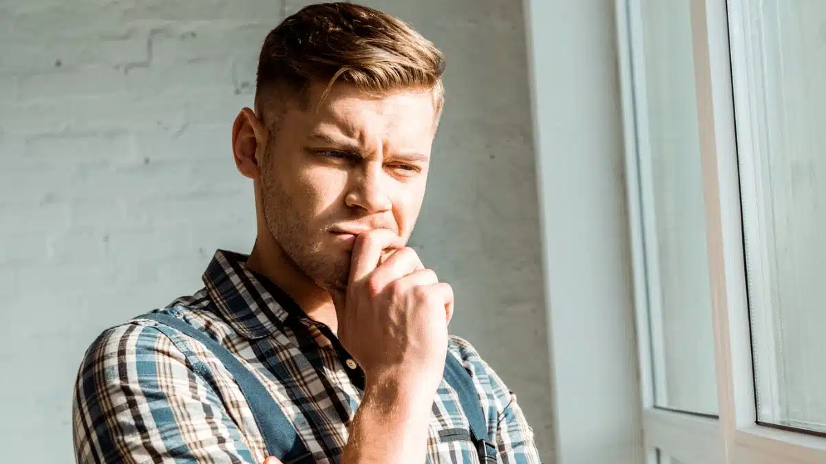 man thinking at the window