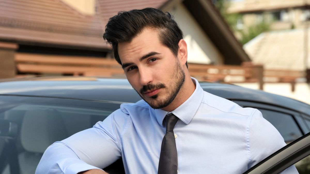 man tie at a car