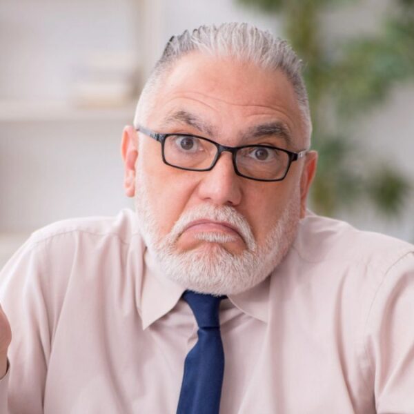 mature man angry at work phone