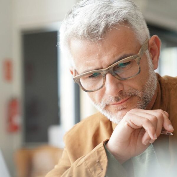 mature man glasses in the office