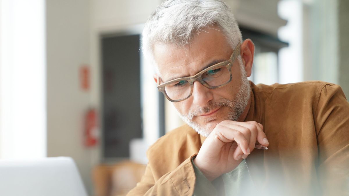 mature man glasses in the office